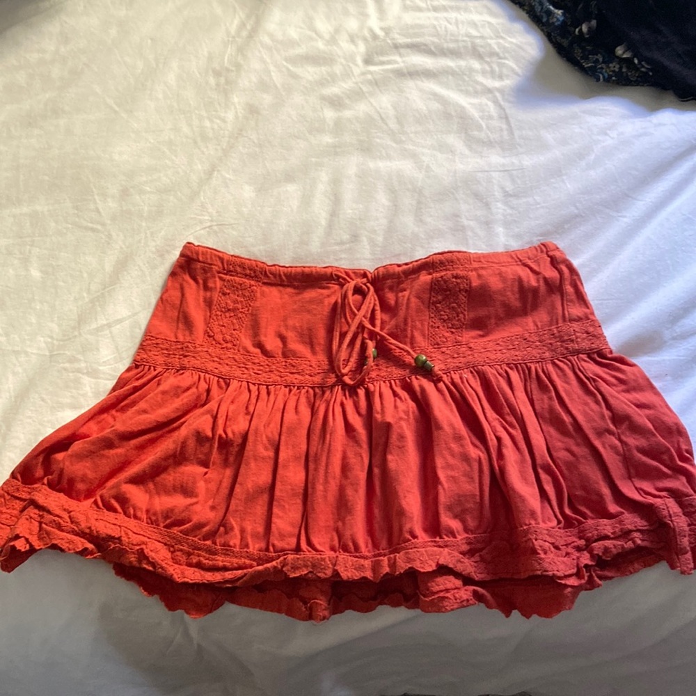 Trendy orange mini skirt with bohemian style